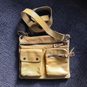 Fossil yellow leather crossbody purse.